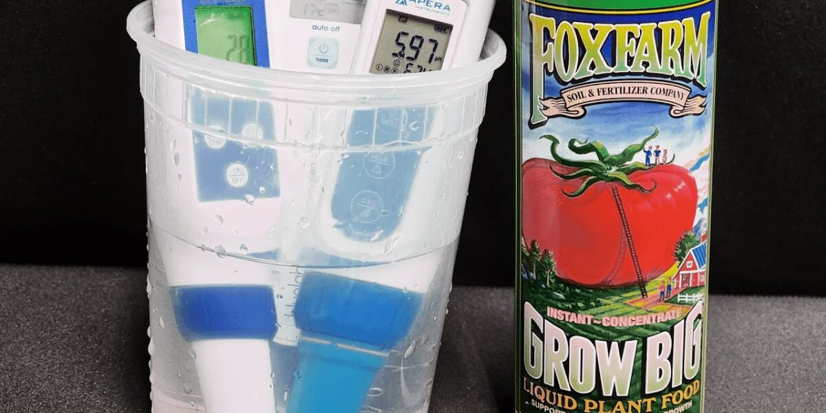 FoxFarm Grow Big 6-4-4 bottle beside pH and EC test equipment