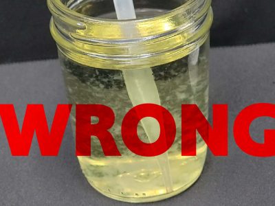 Yellow nutrient solution labeled Wrong during a mixing-order demonstration
